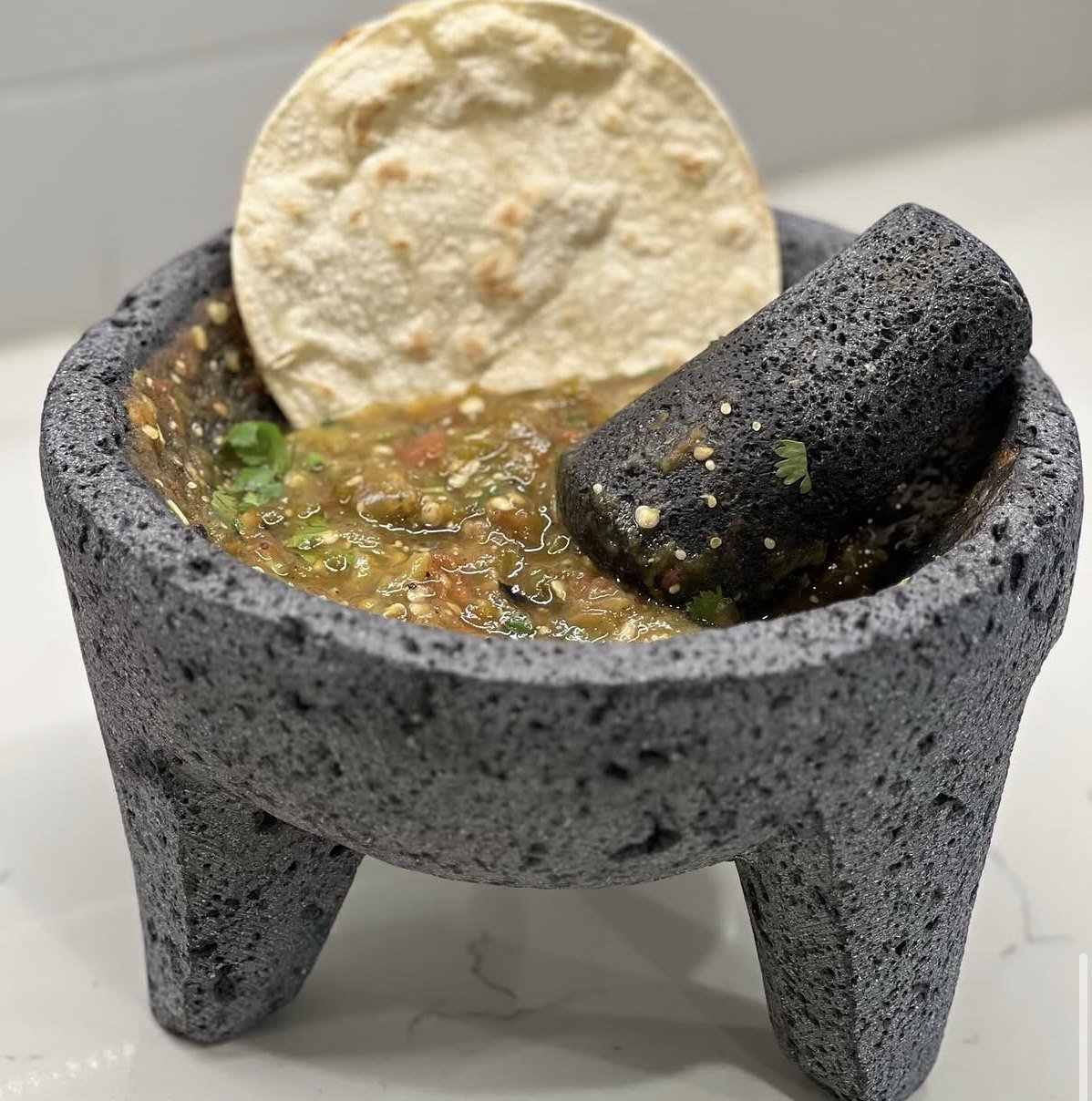 Salsa Zócalo in a molcajete with a tostada